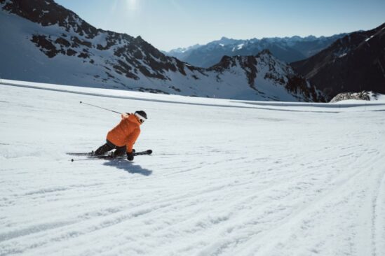 Rich Evans testing Carv 2 on the Stubai Glacier with groomed slopes in the background.