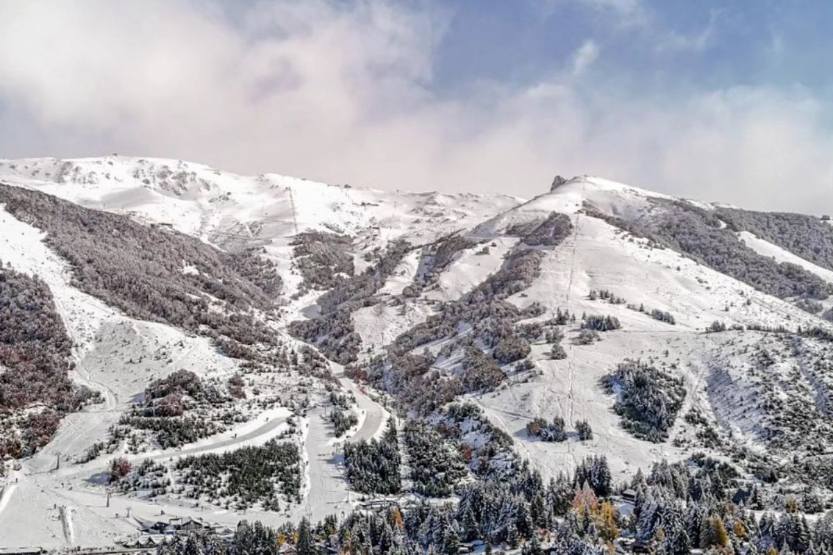 Snow-covered slopes of Catedral Alta Patagonia with tree-lined pistes in Bariloche, Argentina
