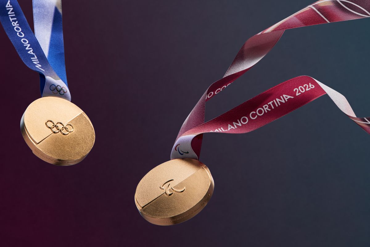 Gold Olympic and Paralympic medals from Milano Cortina 2026, each with distinct ribbon colours and minimalist split design.