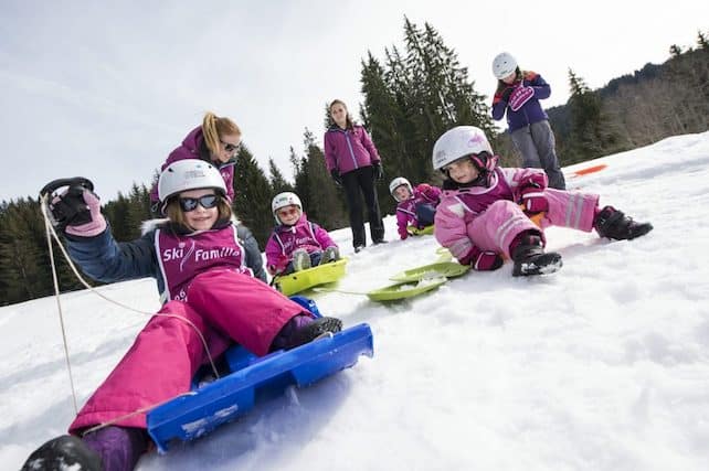 Cute Skiing Children Dressed in Winter Clothes (2974793)