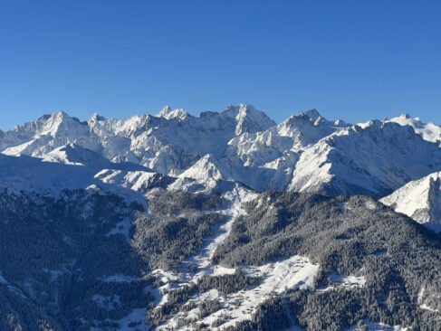 Peaks from Verbier, snow covered against a blue blue sky