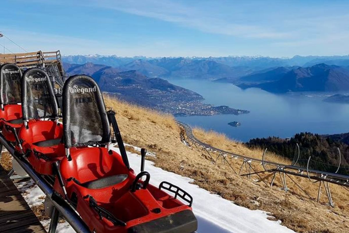 Alpine coaster cars at Alpyland overlooking Lake Maggiore in Italy