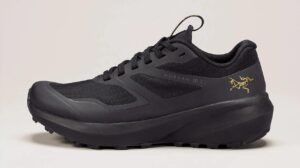 black trail running shoe by Arc'teryx on a pinkish background