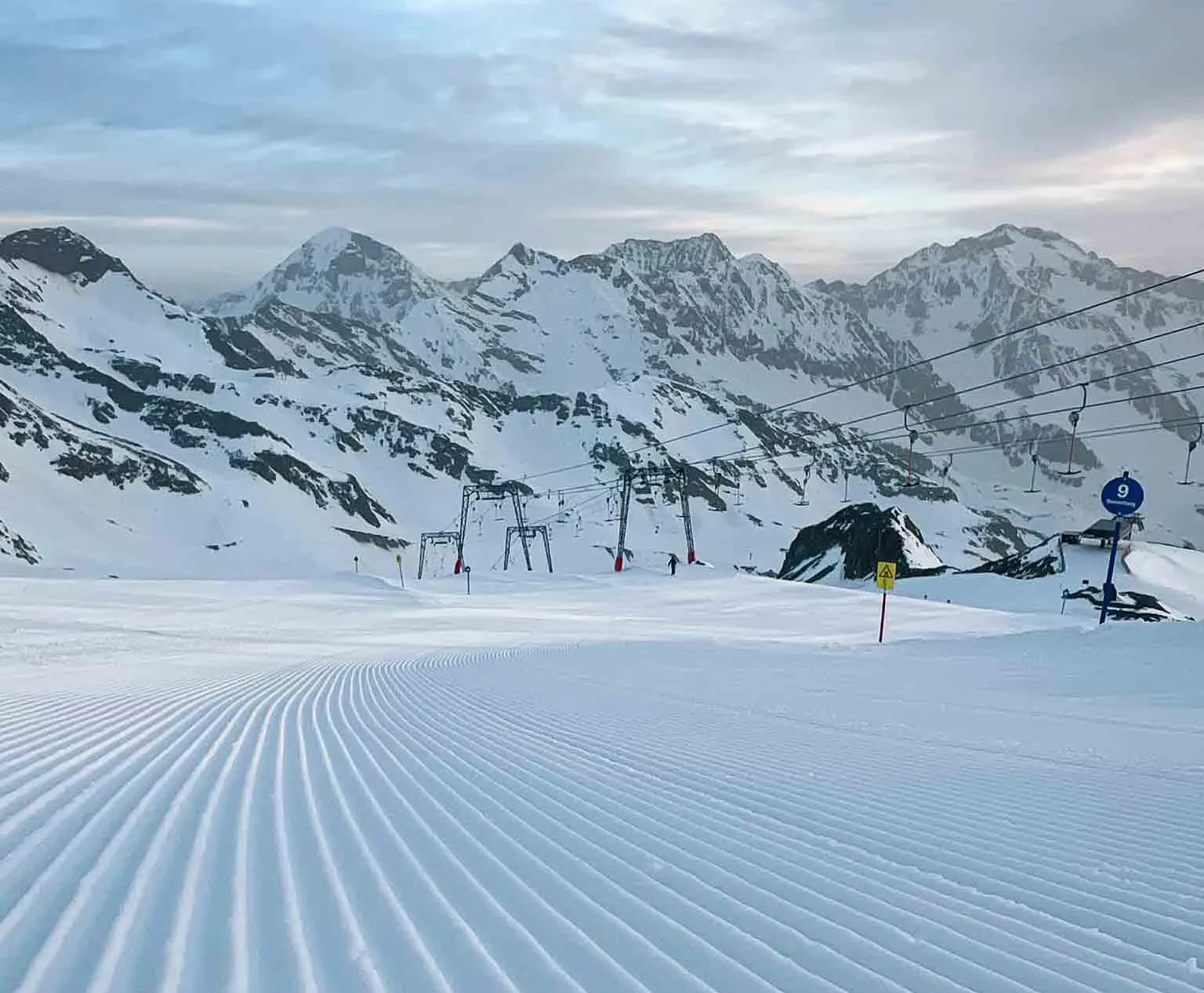 corduroy stripes of a newly pisted piste