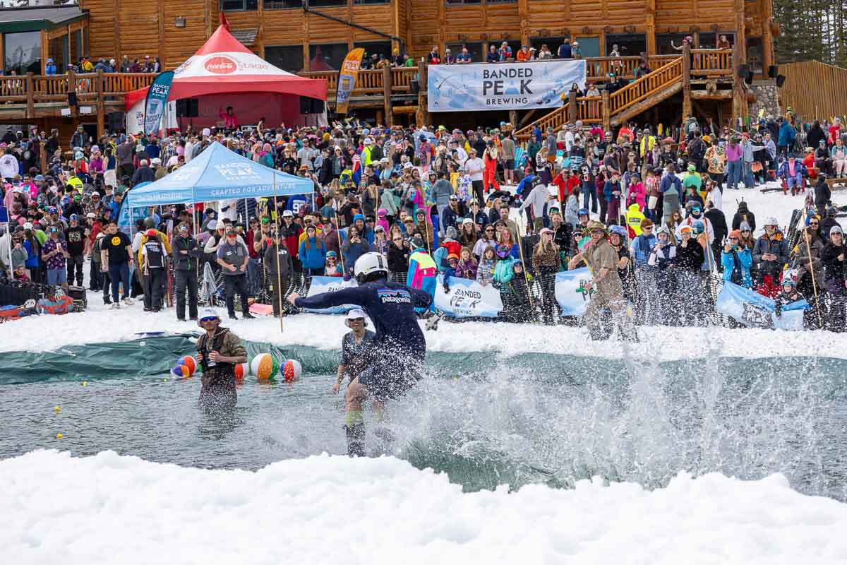 pond-skimming in front of a large crowd