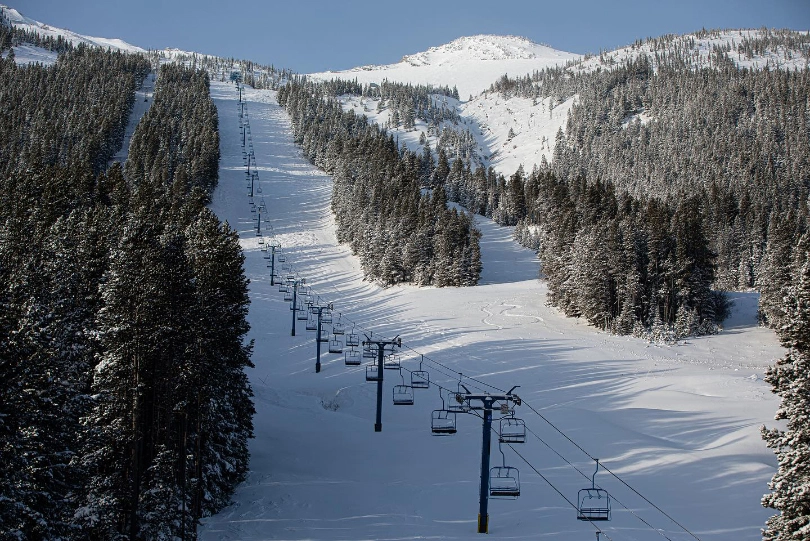 an empty chairlift and piste