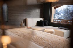 Chalet 14 bedroom interior, with a lovely window view of snowy village and foothills