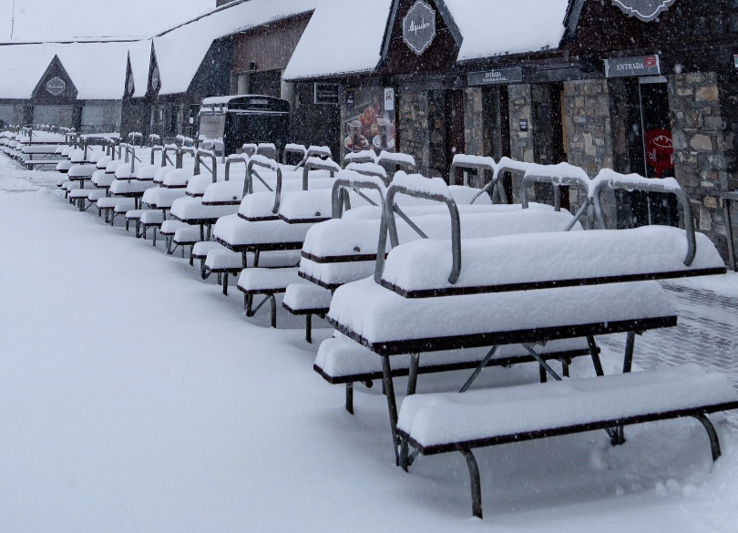 snow topped picnic tables
