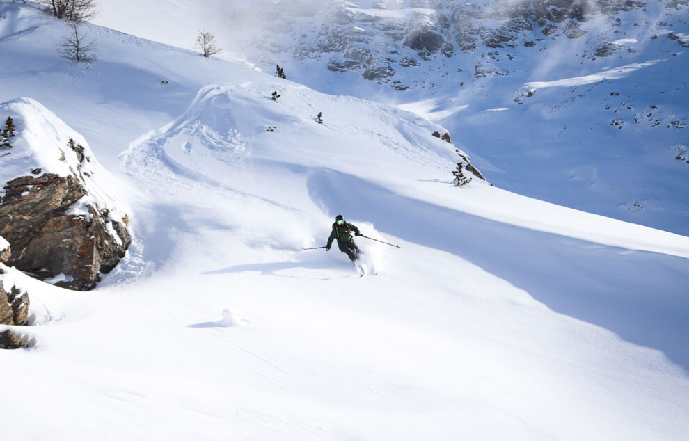 solo skier leaving a fresh track in mellow freeride terrain