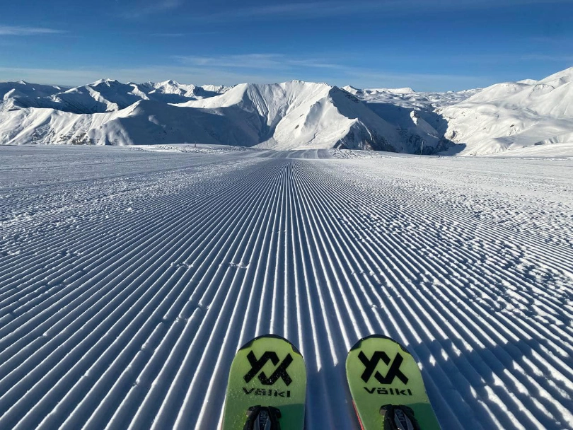 ski tips and corduroy piste