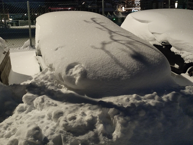 car deep in snow