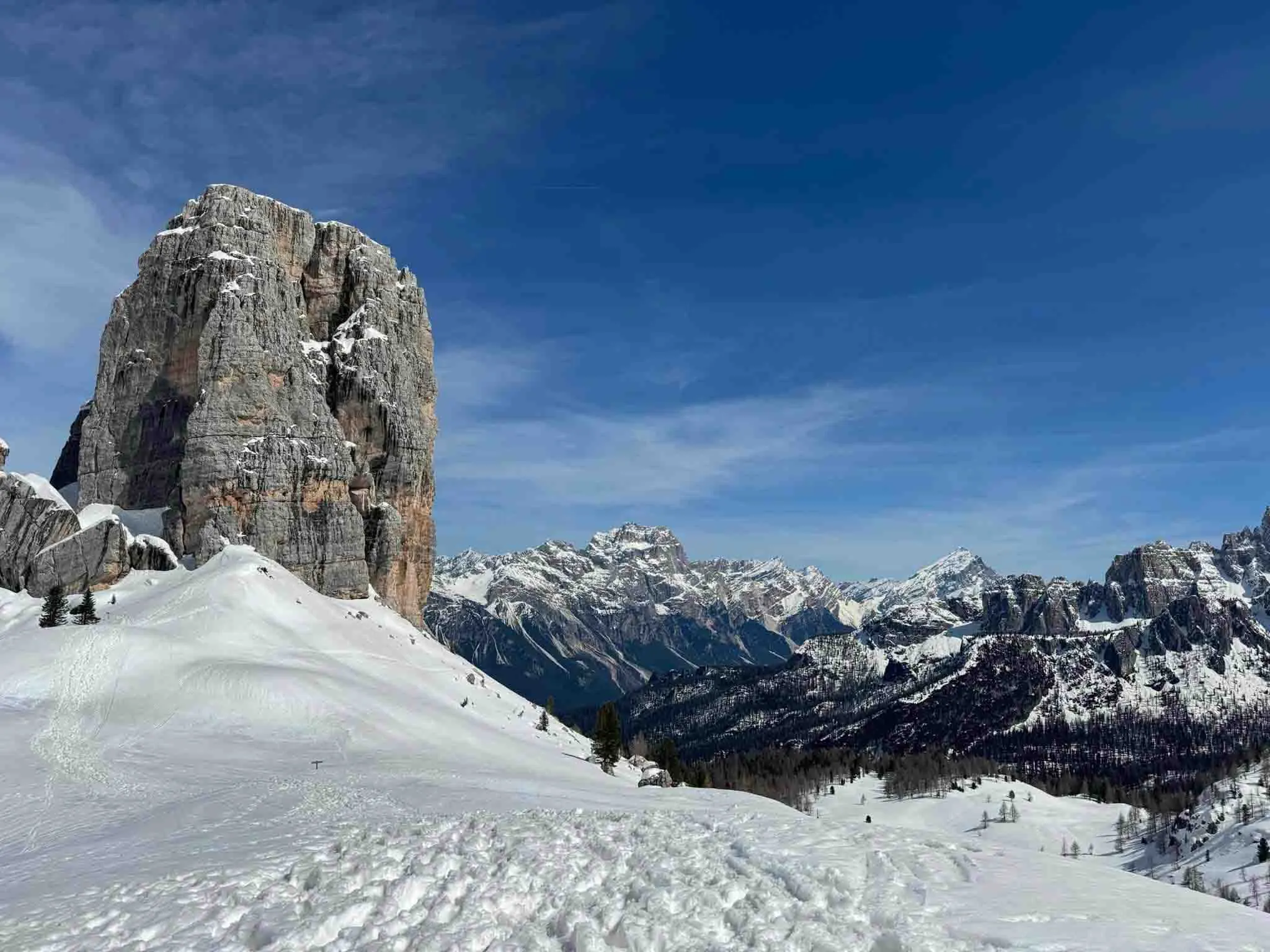 a Dolomite rock stack surrounded by snowy slopes