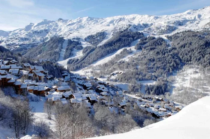 ski resort of Meribel pictured from above, it nestled on the snowy slope below