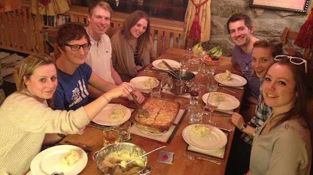 Eating a meal in chalet | How to Survive a Self-Catering Skiing Holiday: 8 Top Tips
