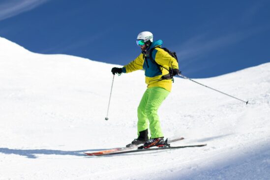 A skier struggling with a stem turn, highlighting common beginner errors in skiing technique.