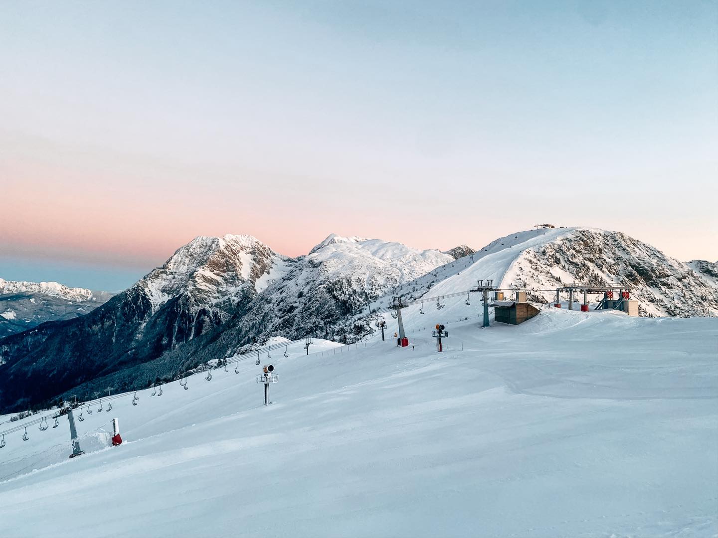 a pastel ski over a quiet ski area