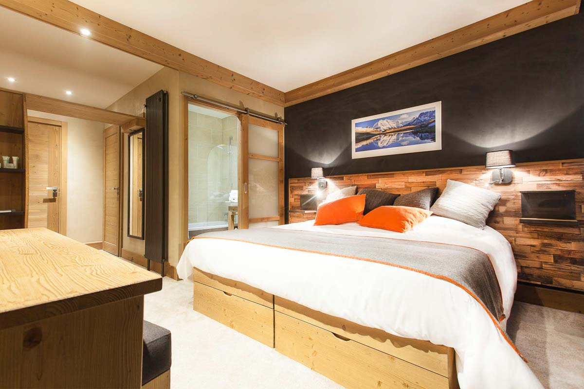 cosy wood-clad alpine bedroom of Hotel St Charles, Val Cenis