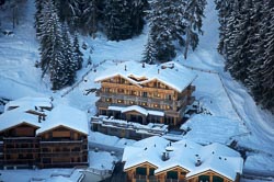 ski lodge aerial shot, snow on roof