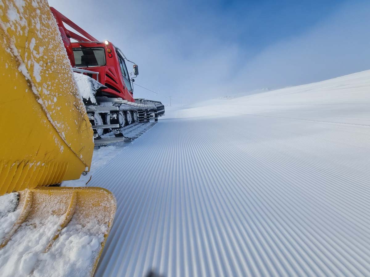 perfect piste photographed from the back of a grooming snowcat