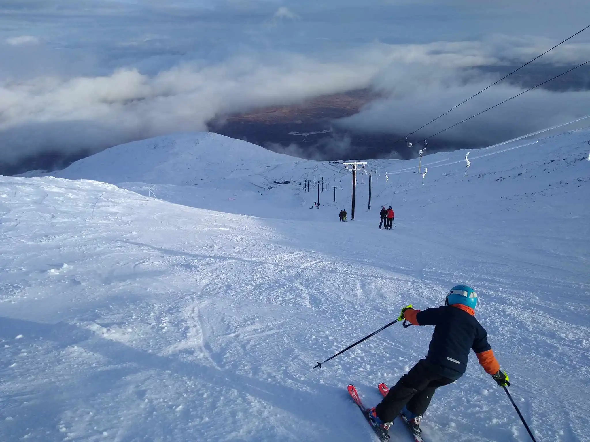 a kid on a carve turn on a Scottish ski hill