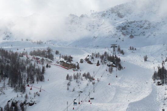 View of snowy slopes and lifts in Val d'Isère, showcasing fresh snow conditions for skiing